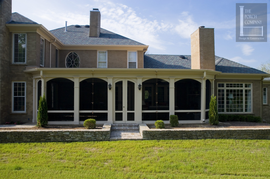 The home below has an open front porch with a flat roof. The front 