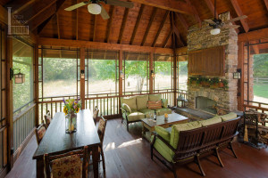 Screened porch with seating and dining area