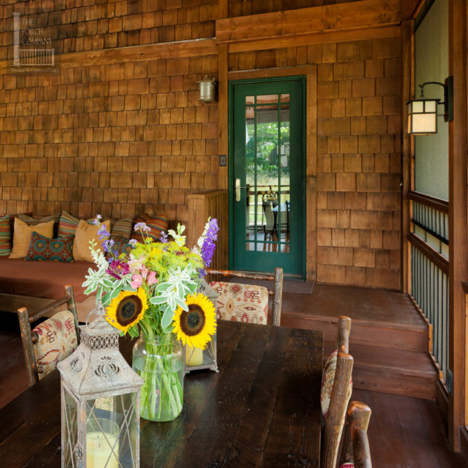 Screened porch with green door - The Porch Company