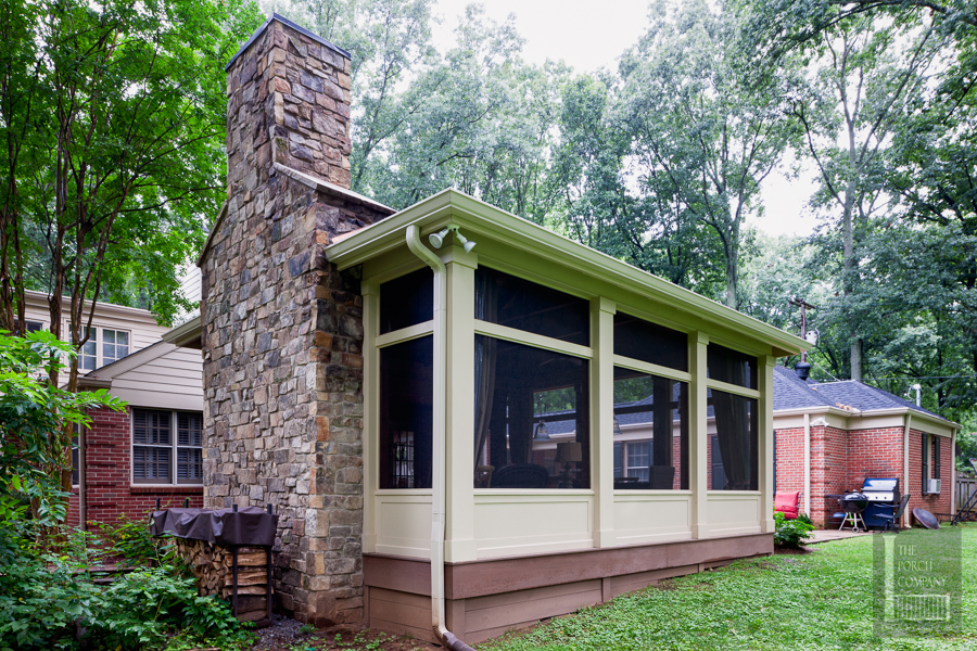 Screened porch exterior shot with fireplace
