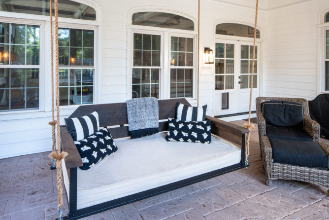 bed-swing-cottage-pine-brown-pavers-porch-screened-