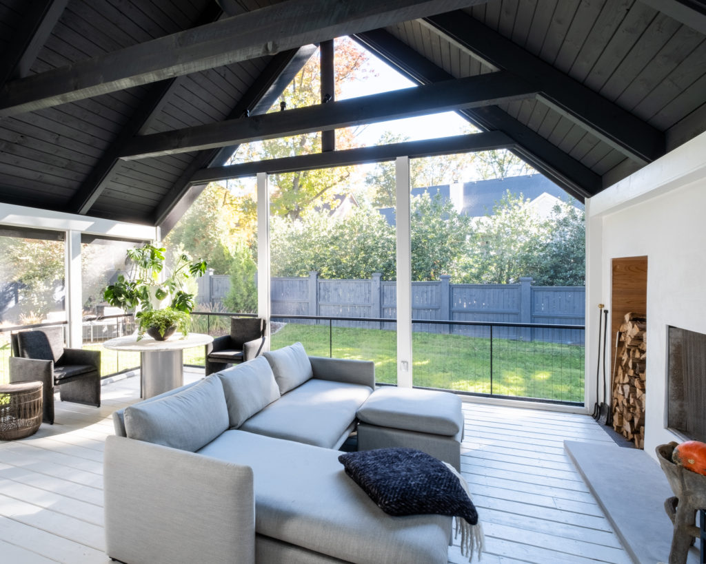 porch-screened-interior-contemporary-fireplace-wood-gable-roof-black-modern-rafters