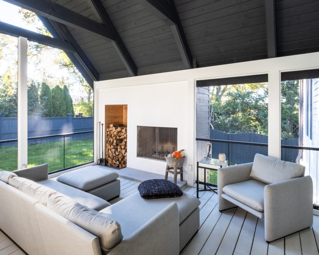 porch-screened-interior-fireplace-contemporary-seating-decor-rafters-gable-modern